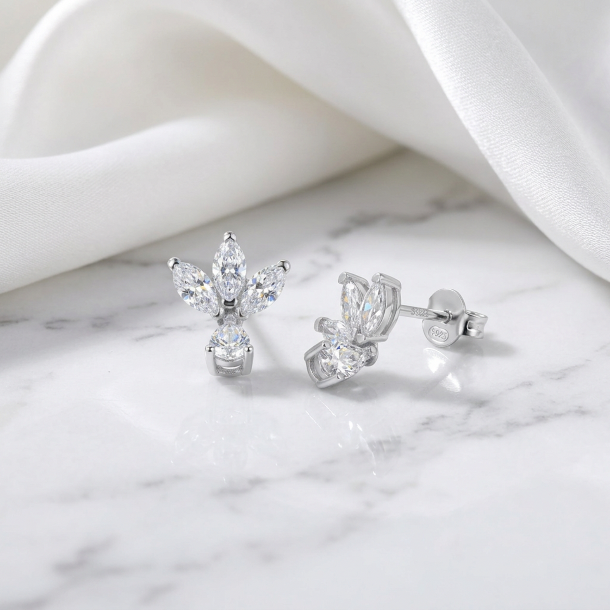 Teo S Silver Earrings